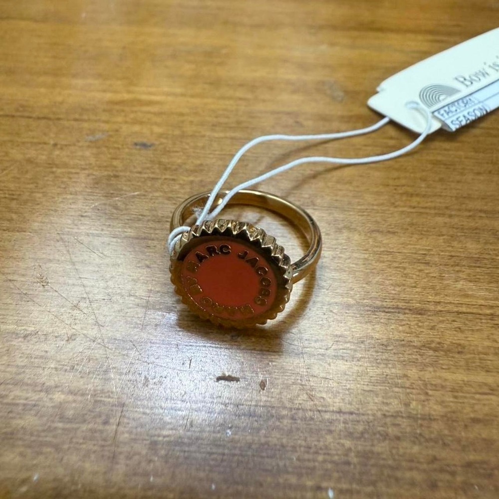 Marc Jacobs gold tone ring with red accents
